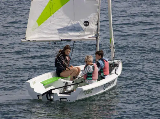 Two students being taught by an instructor in a quest