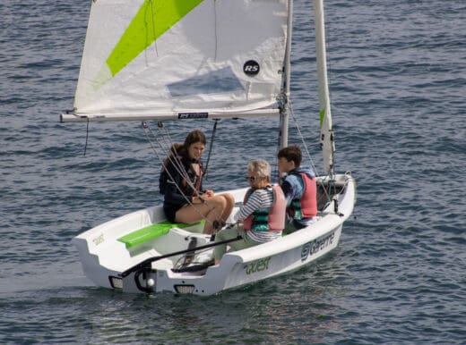 Two students being taught by an instructor in a quest